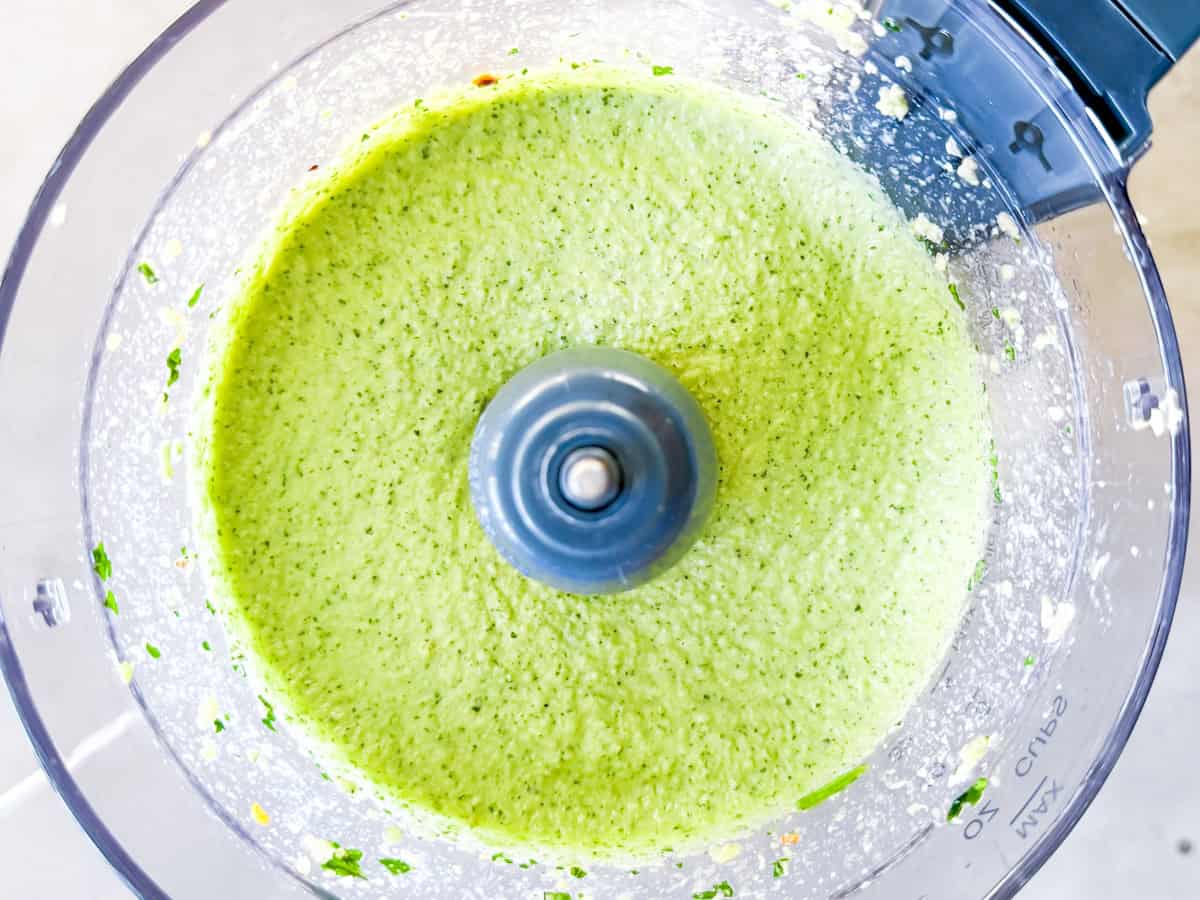 Tahini dressing in the food processor after being blended.