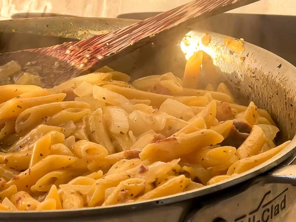 Deglazing the pan with chicken broth.