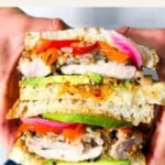 Chicken katsu sando being held.