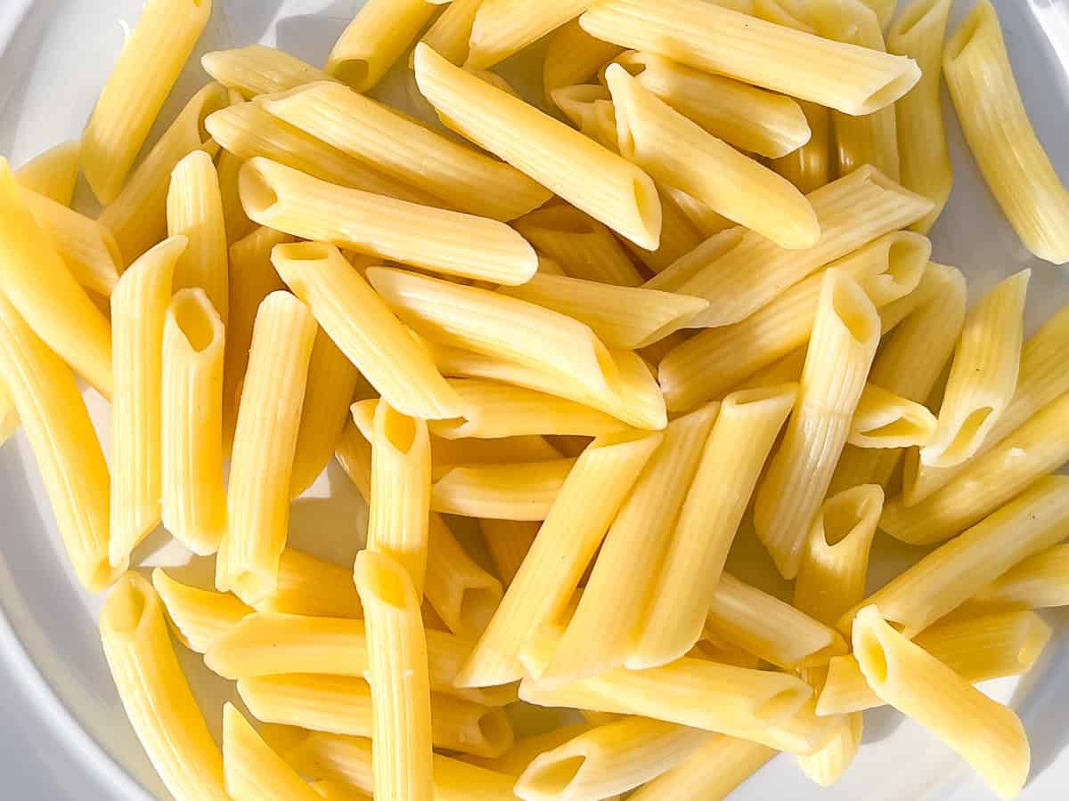 Fully cooked penne pasta.