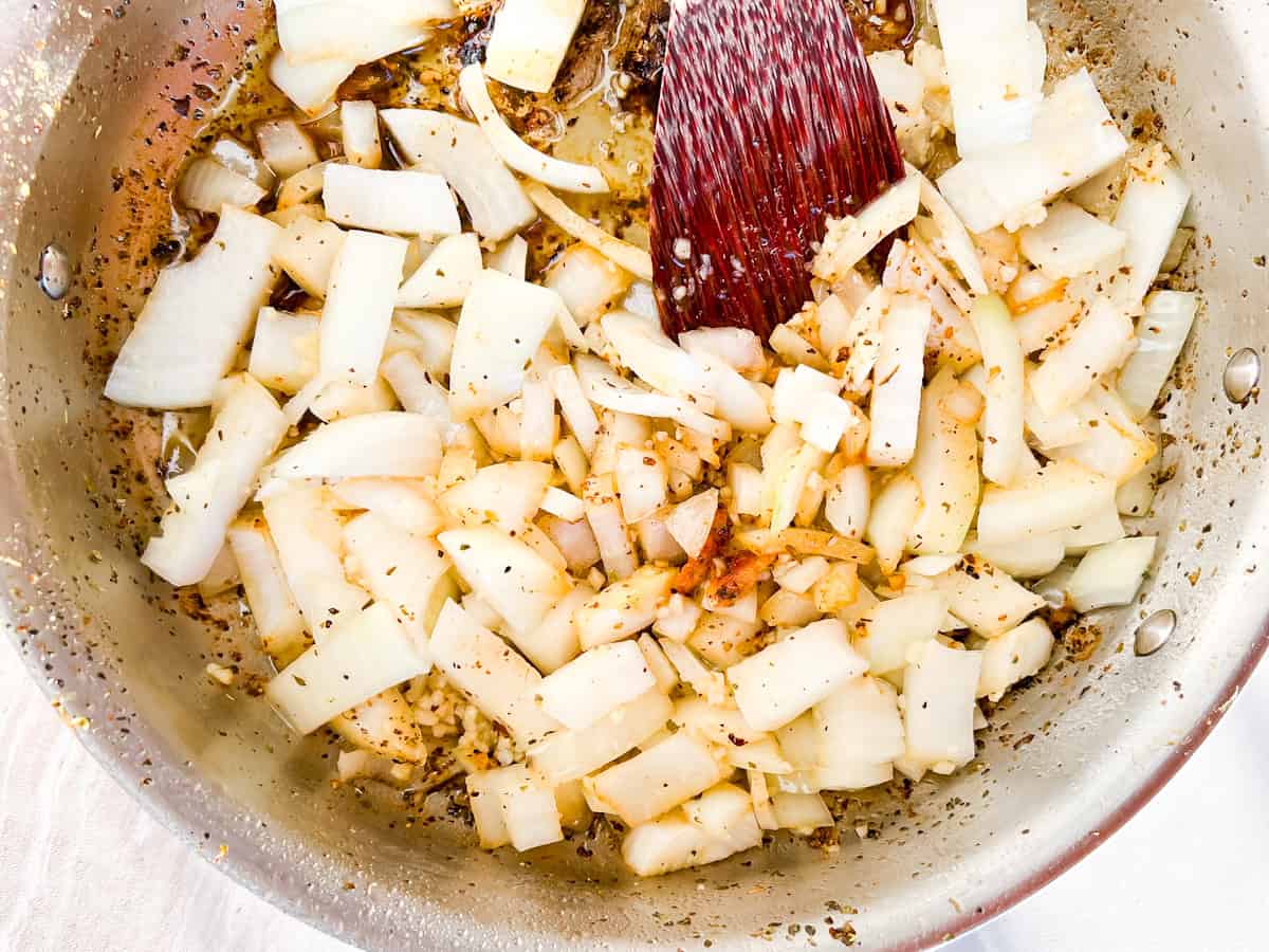 Garlic and onion sautéing in a pan.