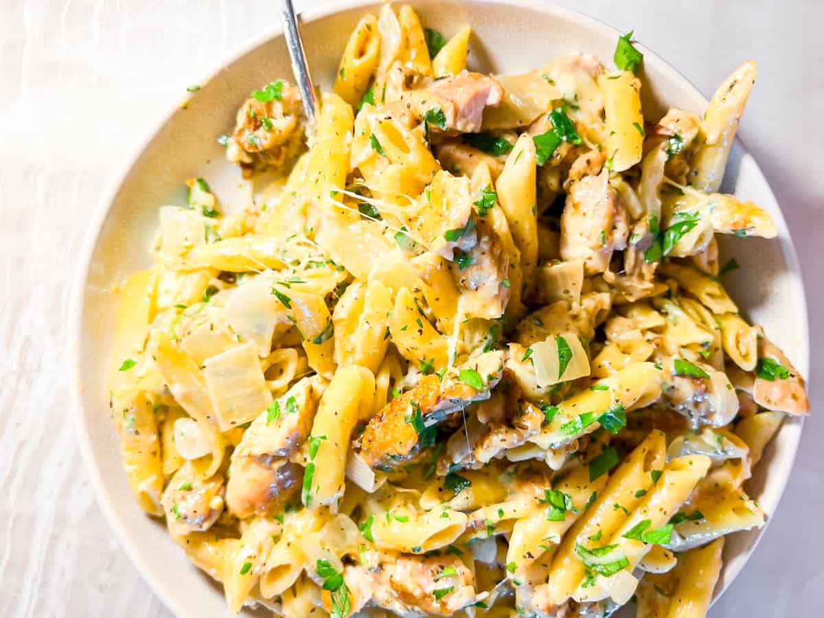 Finished garlic parmesan chicken pasta in a large bowl.