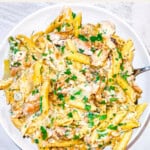 Garlic parmesan pasta on a white plate.