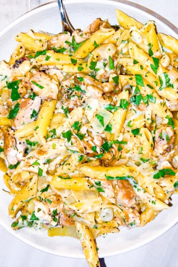 Finished garlic parmesan chicken pasta in a large bowl.