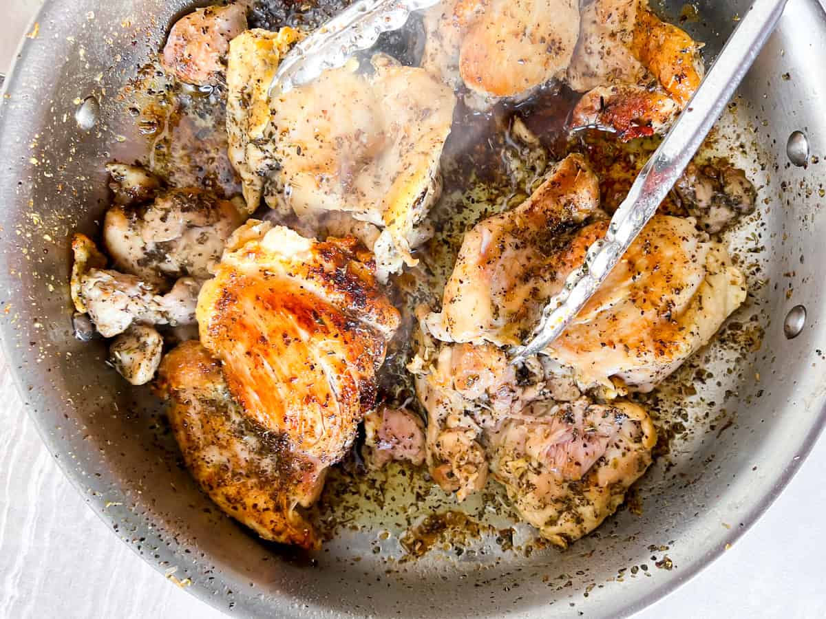 Chicken thighs seasoned and pan-seared.