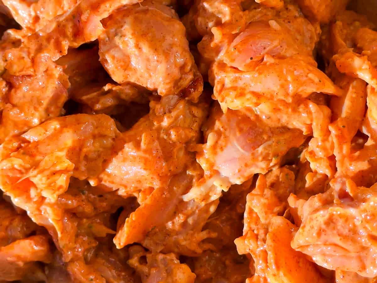 Raw chicken in the marinade/rub.