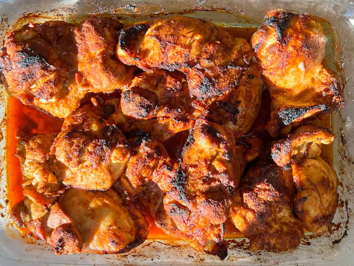 Broiled chicken in a pan.