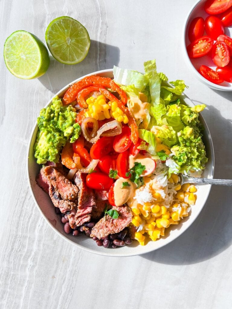 Assembled steak and rice bowls.