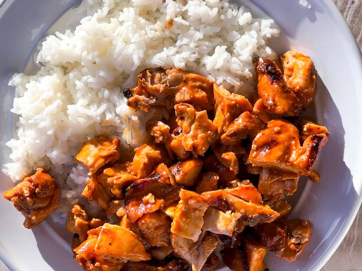 Buffalo chicken bowls being assembled.