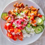 Finished buffalo chicken bowls with chicken, rice, veggies, and sauce.
