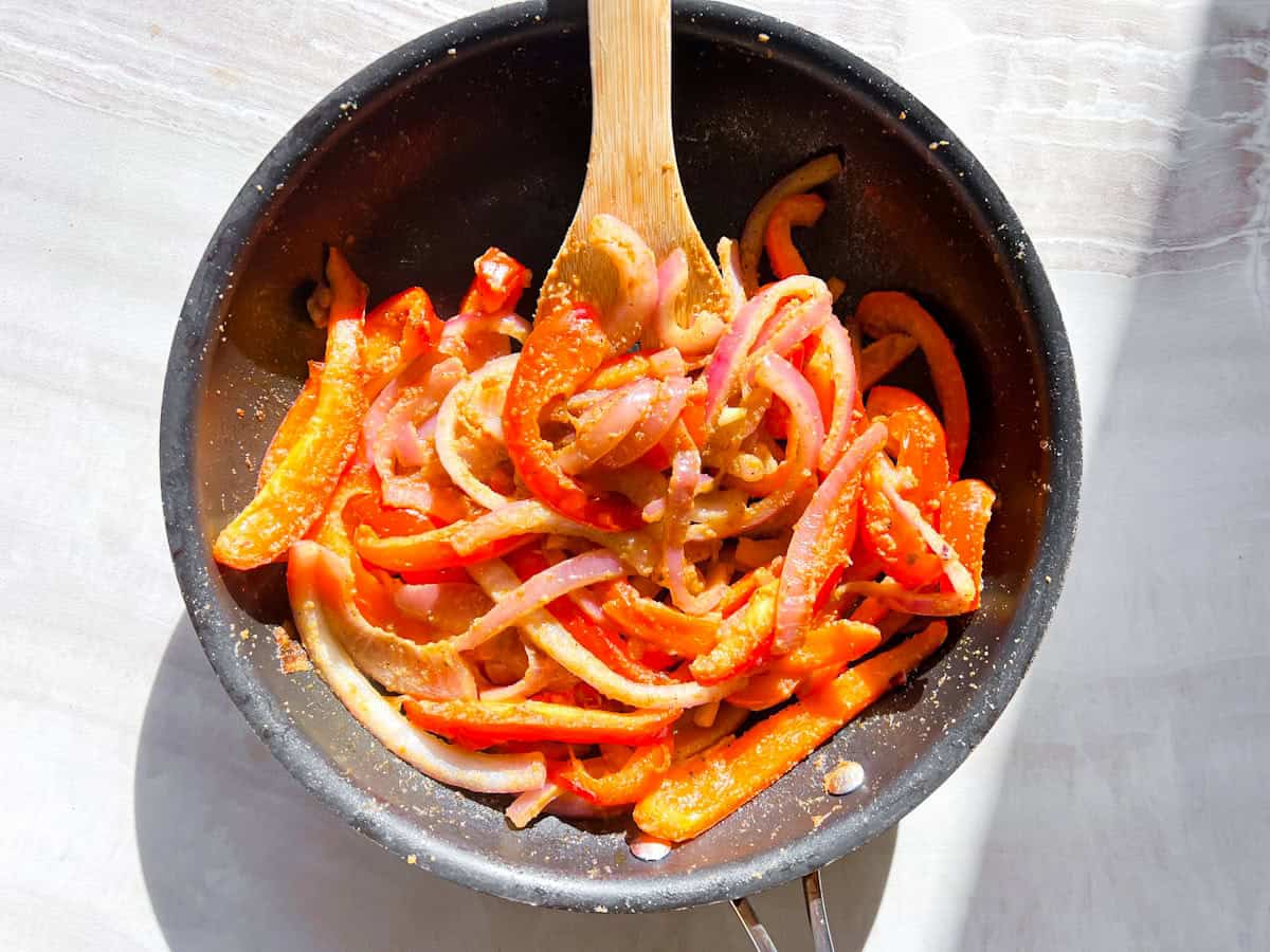 Sautéed veggies in a skillet.