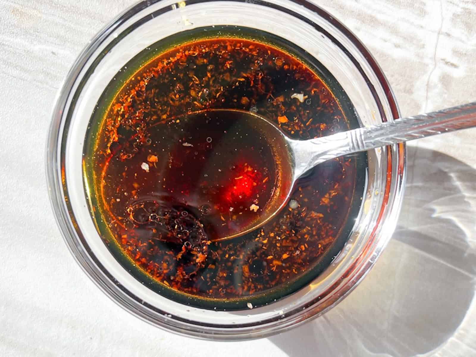 Homemade teriyaki sauce in a clear bowl.