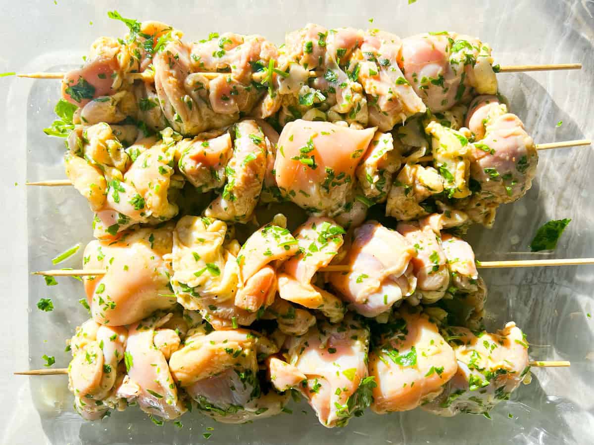 Uncooked garlic parmesan chicken skewers.
