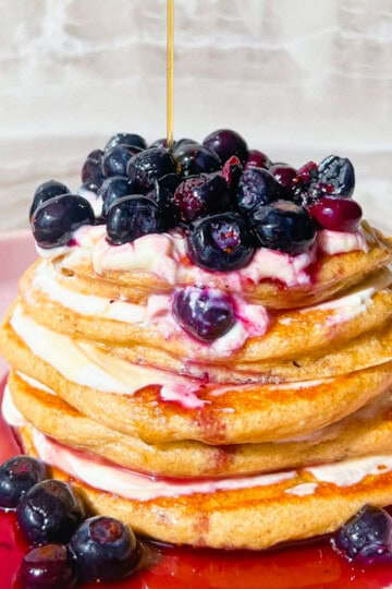 Finished pancakes without protein powder topped with blueberries.