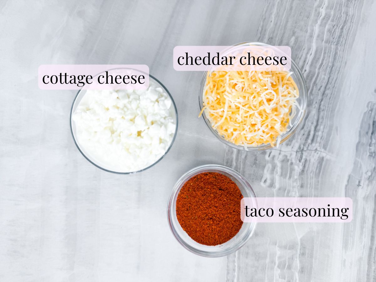 Ingredients for cottage cheese queso in small bowls and labeled.