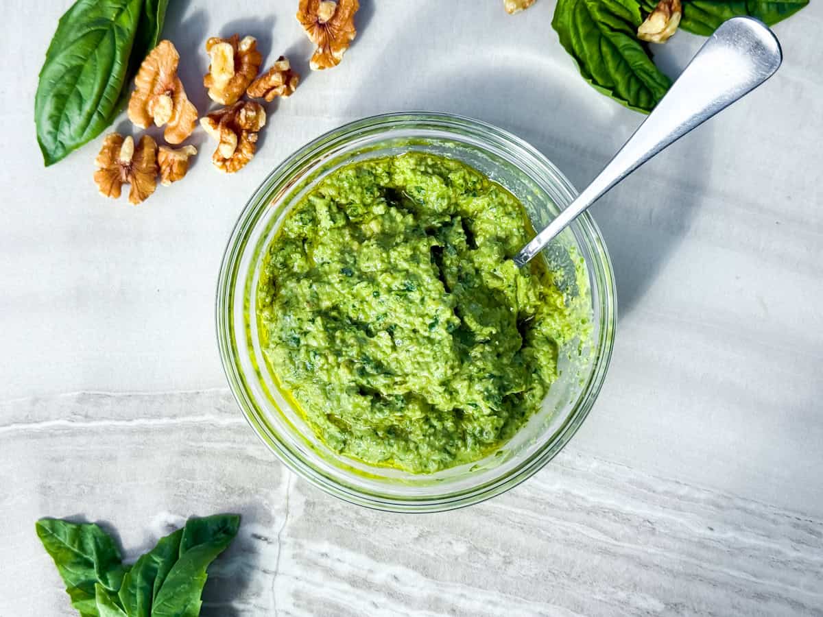 Finished pesto without pine nuts in a small bowl.