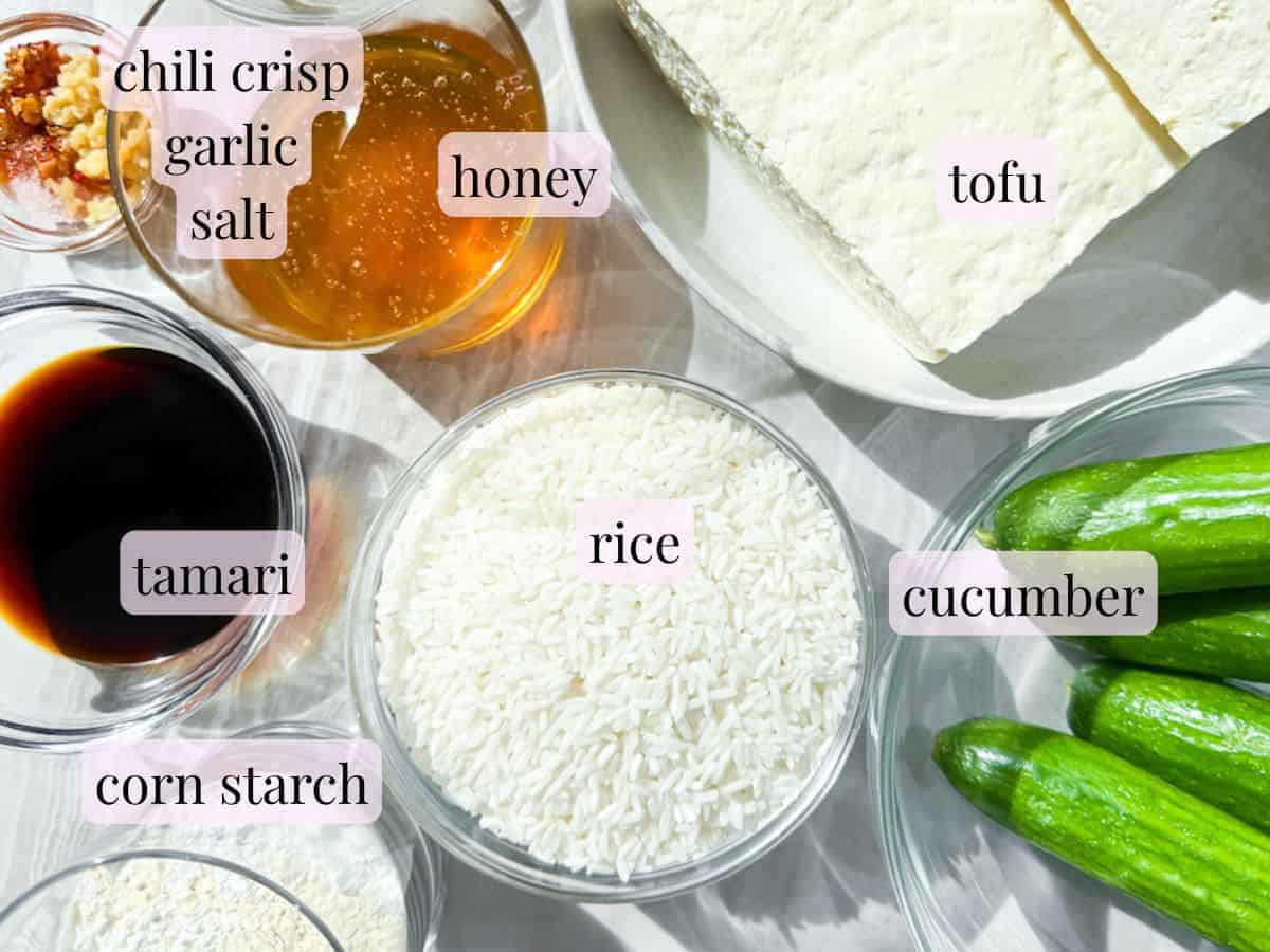 Crispy tofu bowl ingredients in bowls and labeled.