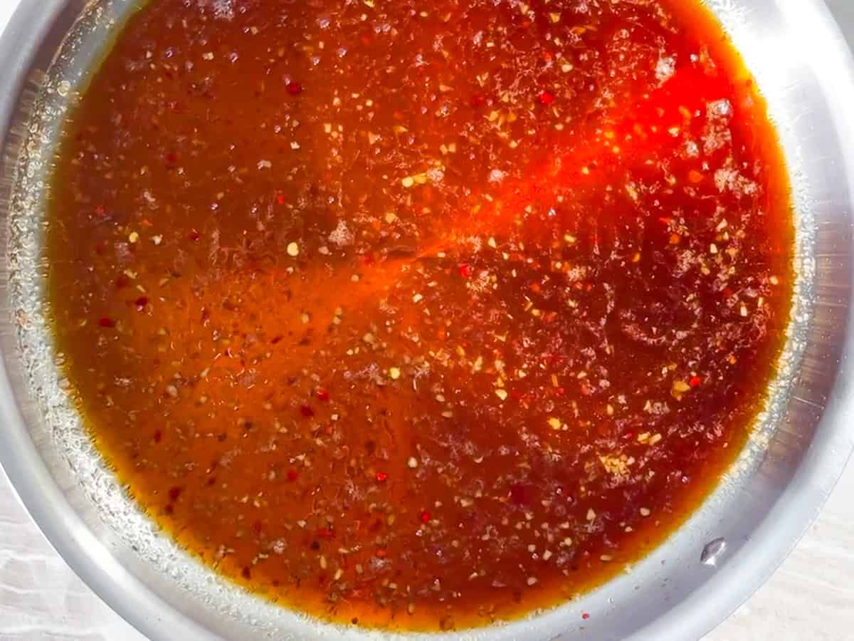 Crispy tofu bowl sauce simmering.