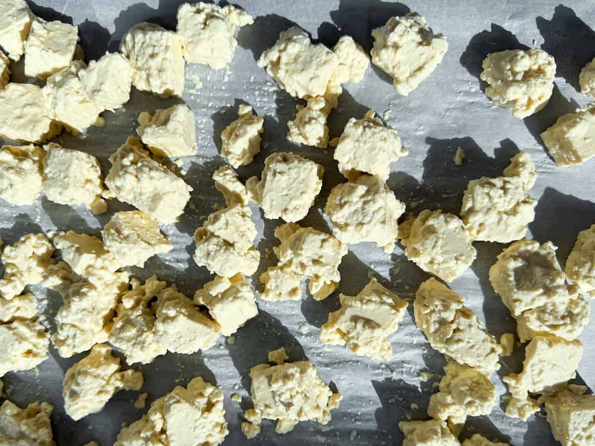 Uncooked tofu on a baking sheet.