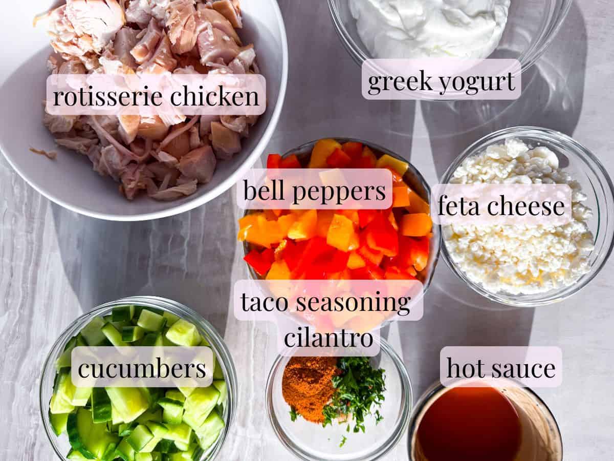 Ingredients prepared in bowls for the buffalo chicken salad.