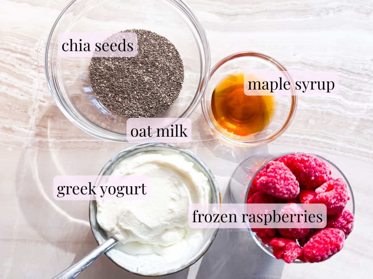 Raspberry chia pudding ingredients in bowls and labeled.