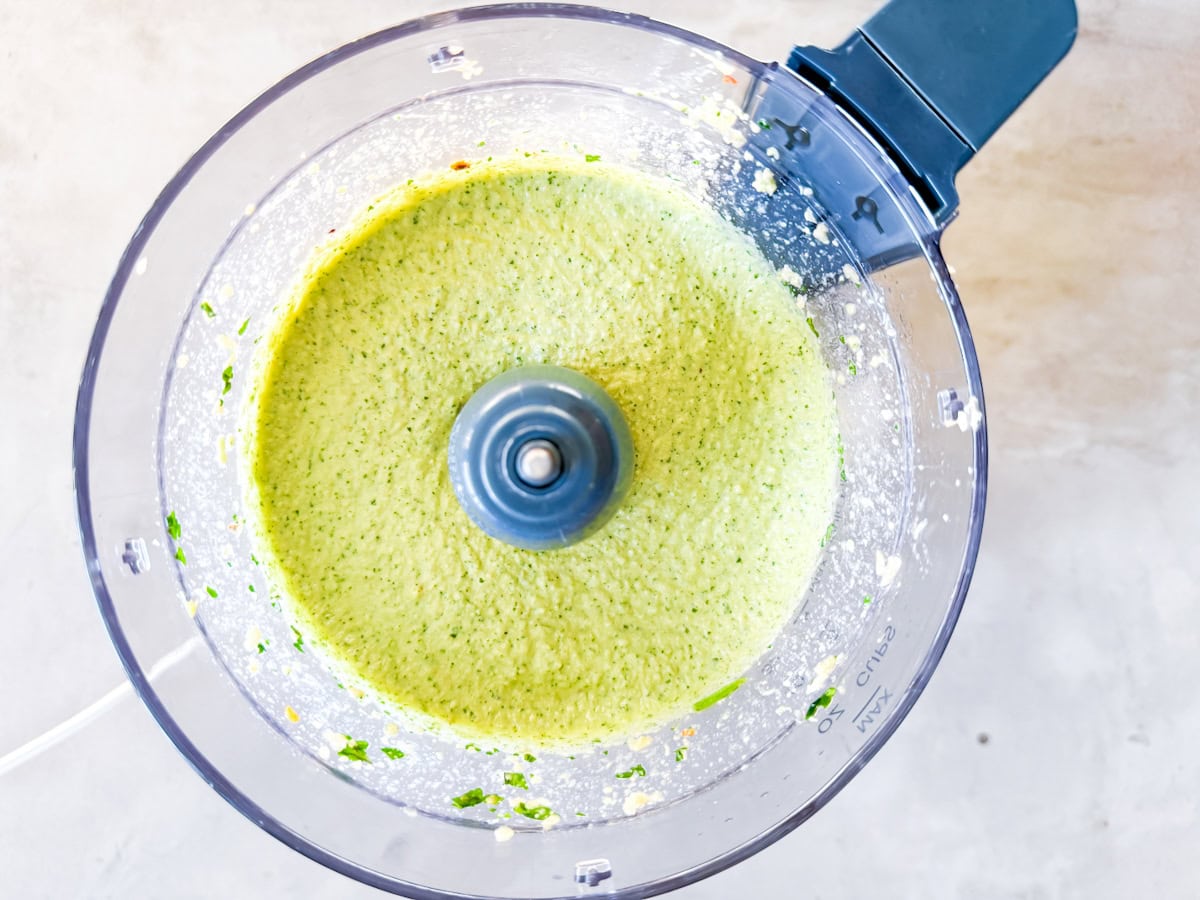 Spicy cashew dressing completely blended in a food processor.