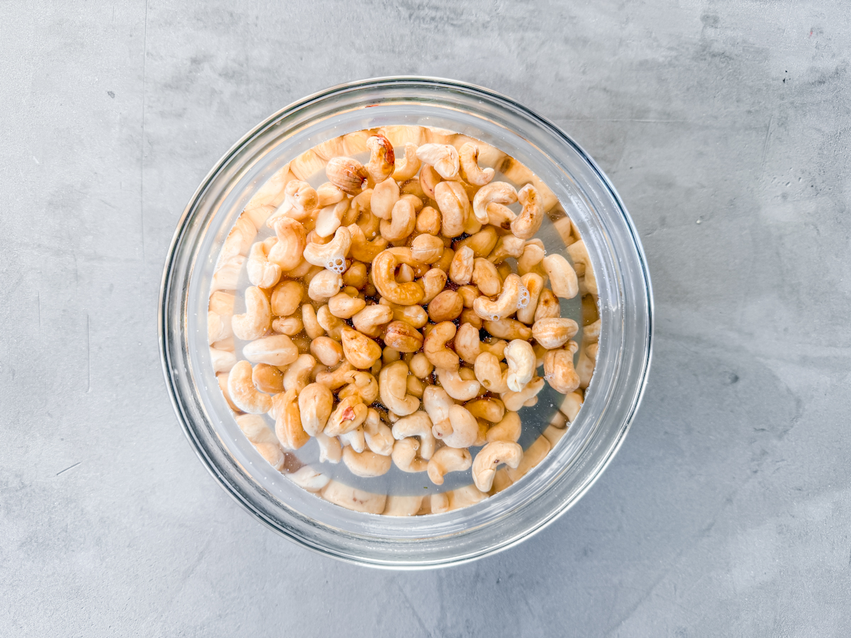 Cashews soaking in hot water.