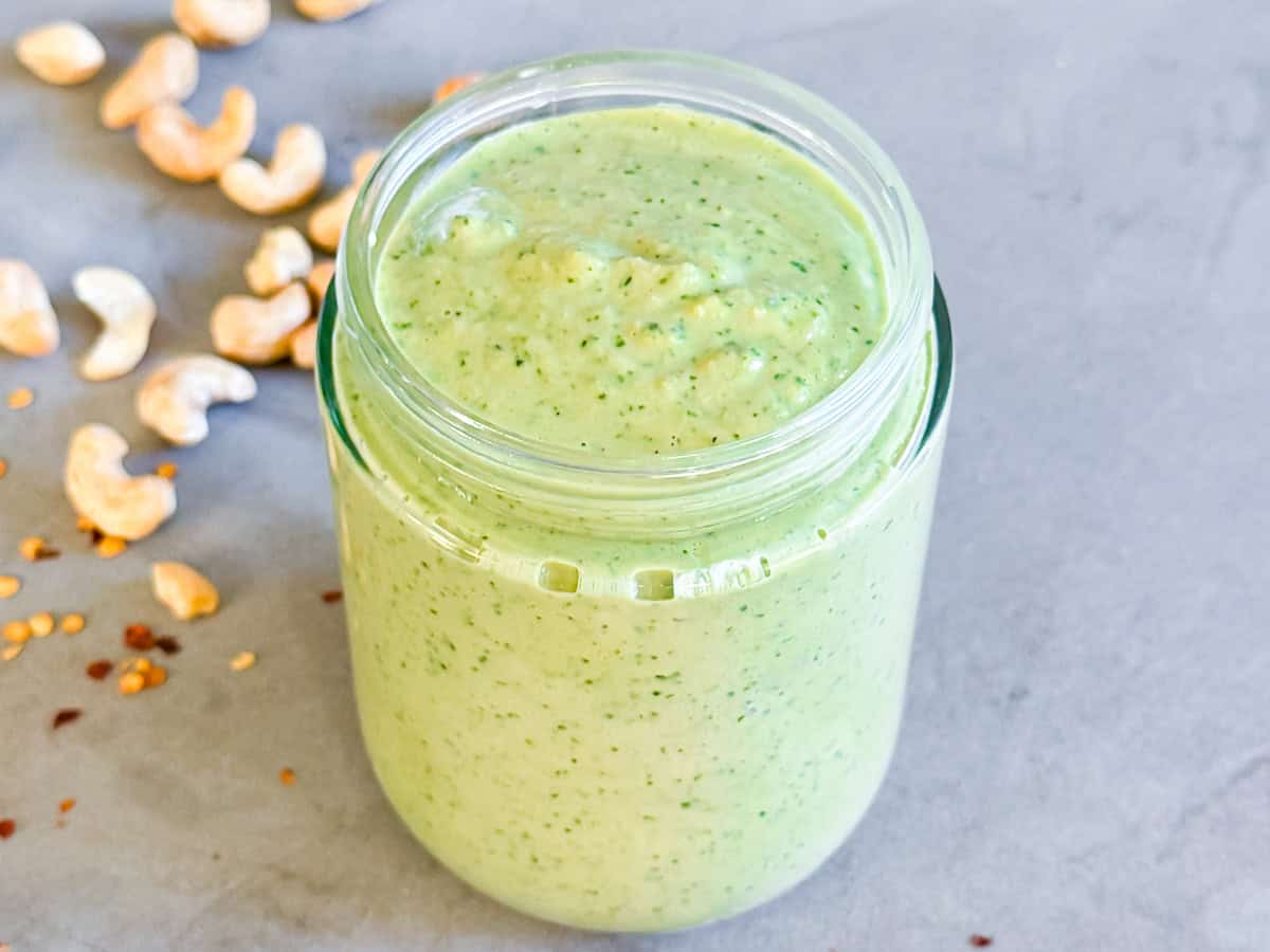Spicy cashew dressing in a meal prep jar.