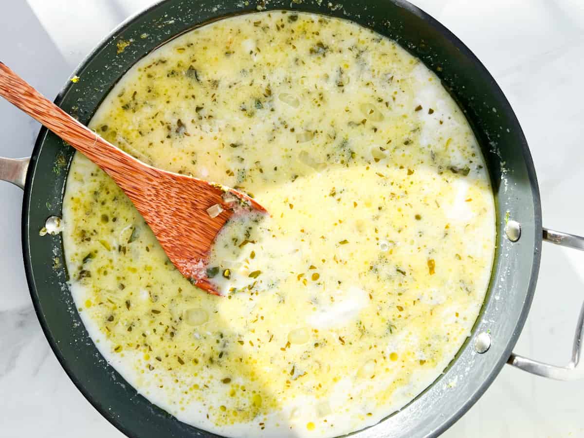 Broth for the chicken piccata soup in a pan.