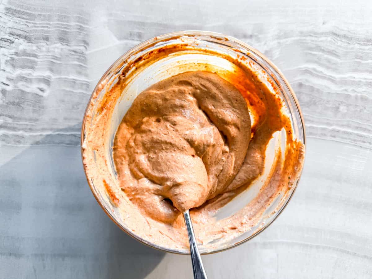 Greek yogurt taco seasoning dressing in a bowl.