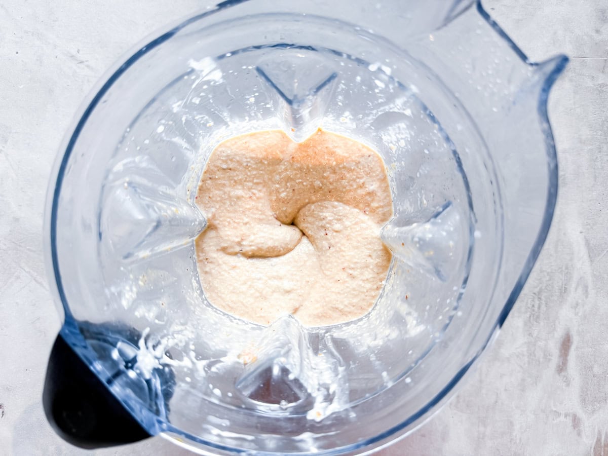 Peanut butter banana smoothie blended in a blender.