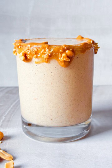 Finished peanut butter smoothie in a glass.
