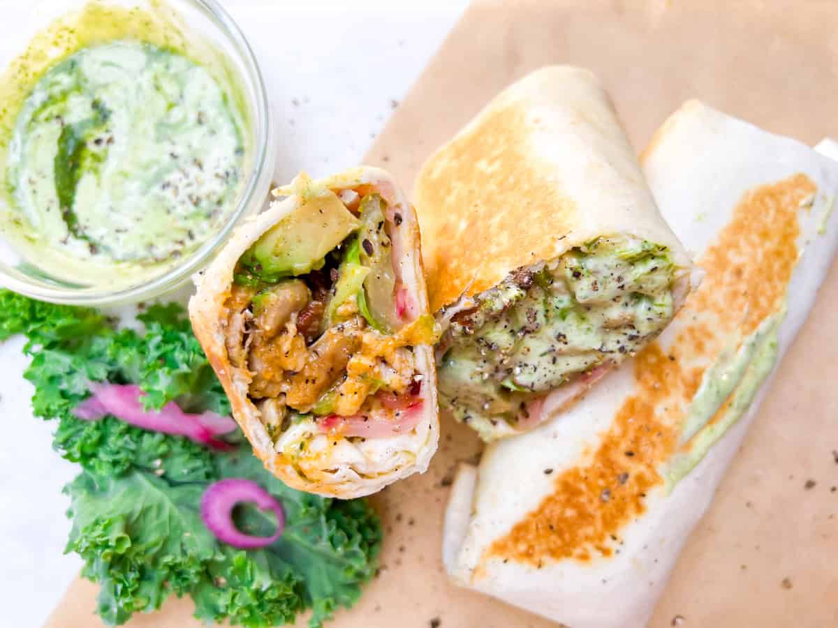 Buffalo chicken wrap cut in half.