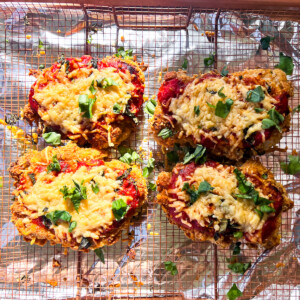 Finished gluten-free chicken parmesan on a wire rack.