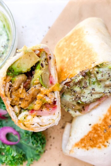 Finished and halved buffalo chicken wrap.