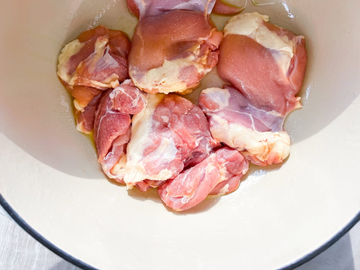 Raw chicken in the dutch oven.