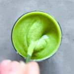 Finished matcha smoothie being stirred.