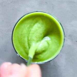 Finished matcha smoothie being stirred.