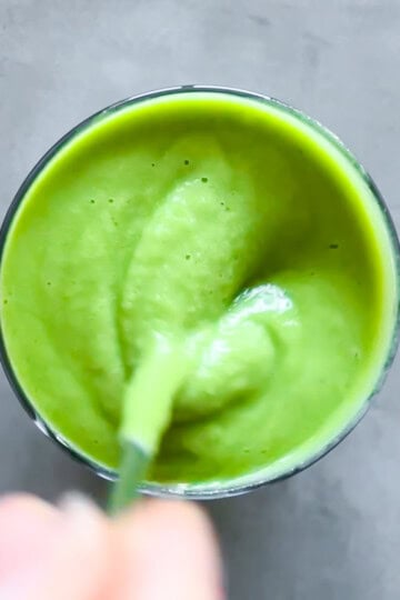 Finished matcha smoothie being stirred.
