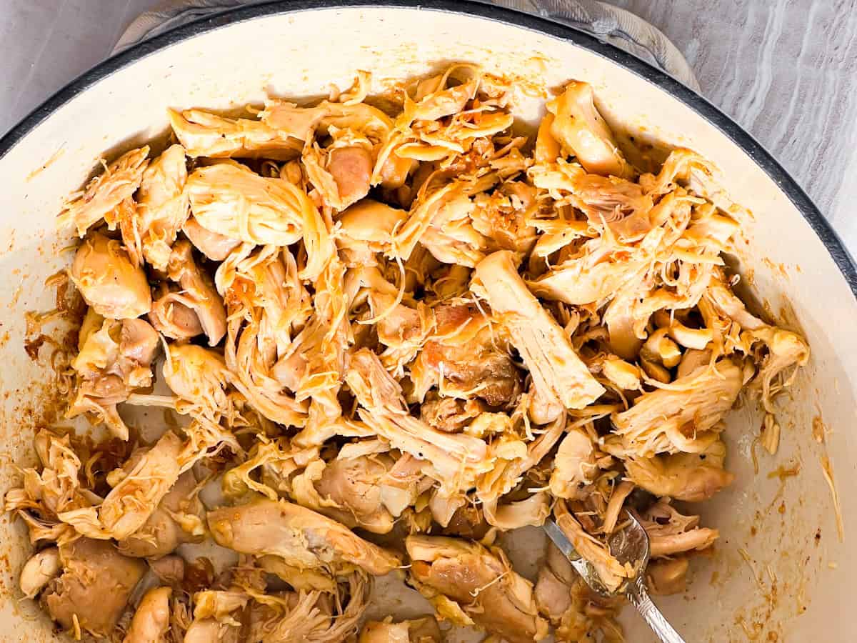 Shredded chicken in the dutch oven.
